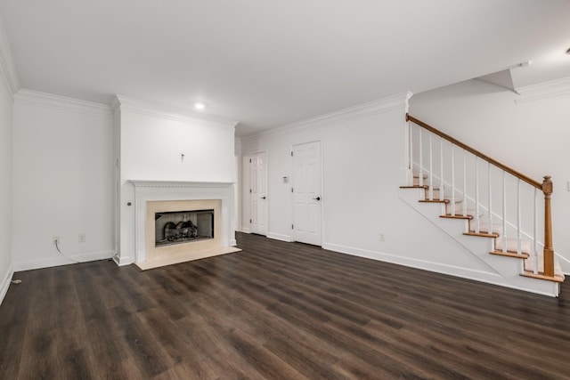unfurnished living room with crown molding, wood finished floors, baseboards, and stairs