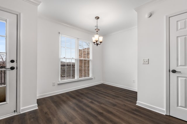 unfurnished dining area featuring crown molding, a chandelier, baseboards, and dark wood-type flooring