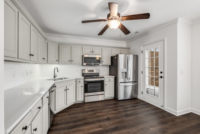 kitchen with light countertops, stainless steel appliances, visible vents, and a sink