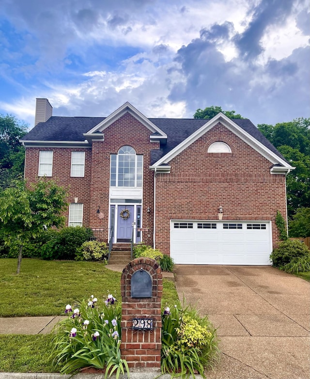 298 Wisteria Dr, Franklin, TN 37064 - view of front of house with driveway, a chimney, a front lawn, brick siding, and a shingled roof