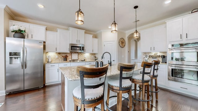 kitchen featuring crown molding, appliances with stainless steel finishes, dark wood-style floors, and backsplash
