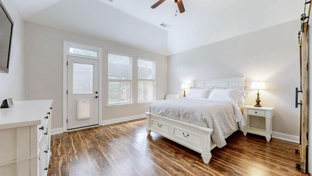 bedroom with baseboards, dark wood finished floors, and visible vents