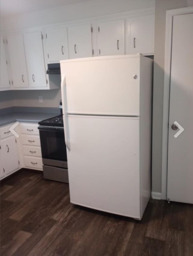 365 Peabody Dr, Clarksville, TN 37042 - kitchen with freestanding refrigerator, white cabinetry, dark wood finished floors, and electric stove