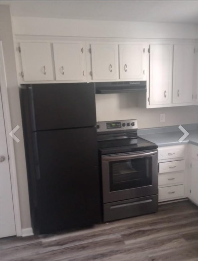 365 Peabody Dr, Clarksville, TN 37042 - kitchen featuring freestanding refrigerator, stainless steel electric range oven, under cabinet range hood, and white cabinetry