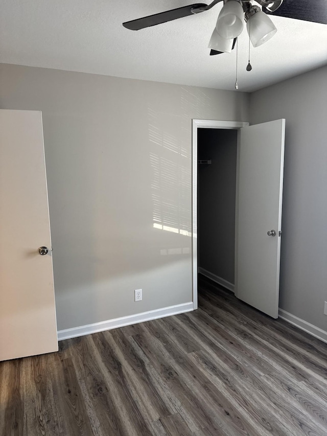 365 Peabody Dr, Clarksville, TN 37042 - unfurnished bedroom with baseboards, wood finished floors, and a ceiling fan