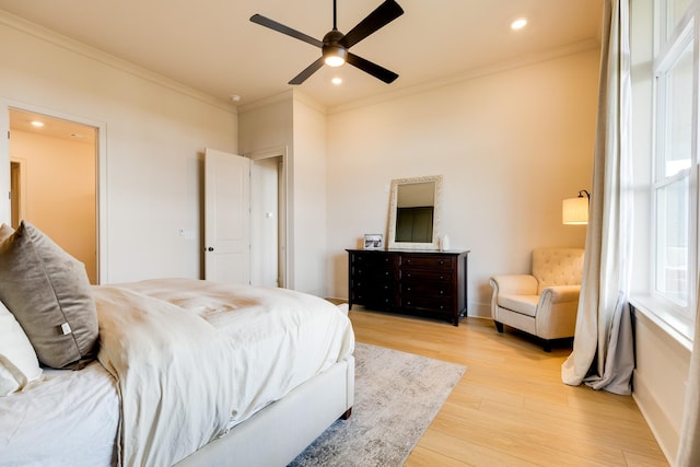 bedroom featuring crown molding, light wood-style flooring, baseboards, and recessed lighting
