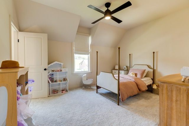 carpeted bedroom featuring lofted ceiling and ceiling fan