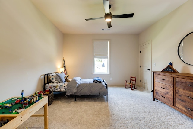 bedroom with ceiling fan, carpet, and visible vents