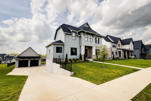 french country style house featuring stone siding, a residential view, board and batten siding, an outdoor structure, and a front yard