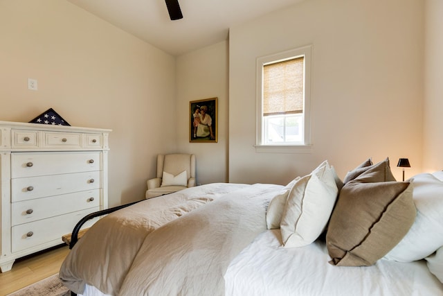 bedroom with light wood-style flooring and ceiling fan