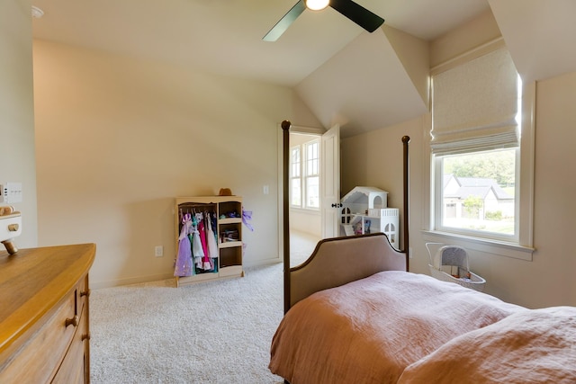 carpeted bedroom featuring baseboards, a ceiling fan, and lofted ceiling