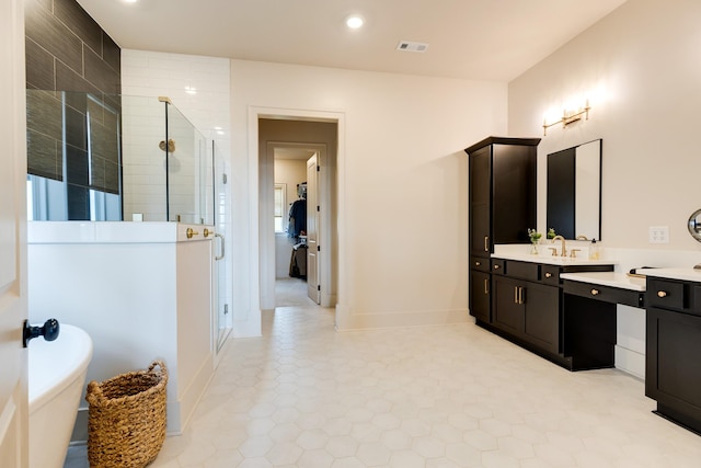 full bath with a stall shower, visible vents, tile patterned floors, vanity, and a freestanding tub