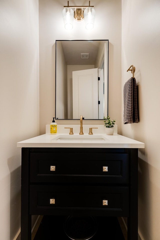 bathroom featuring visible vents and vanity