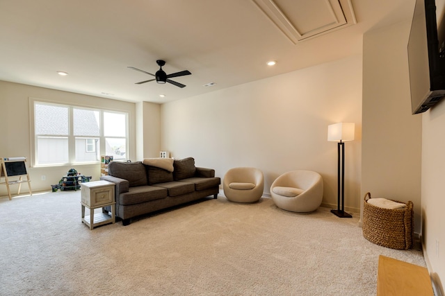carpeted living room with attic access, baseboards, a ceiling fan, and recessed lighting