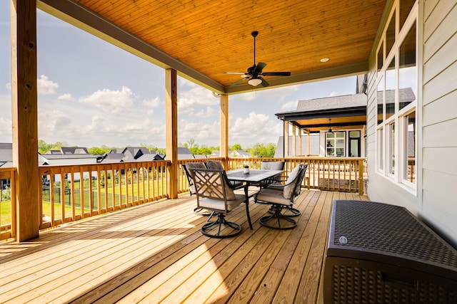 wooden deck with ceiling fan and outdoor dining space