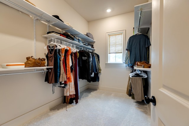 walk in closet featuring carpet
