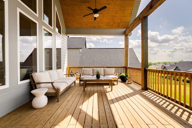 wooden deck featuring ceiling fan and an outdoor living space