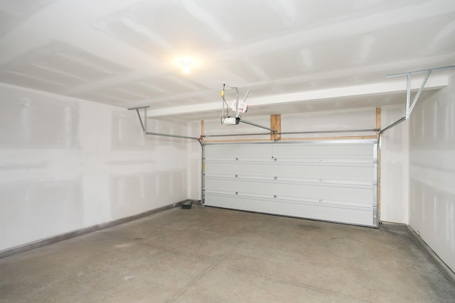 garage featuring baseboards and a garage door opener