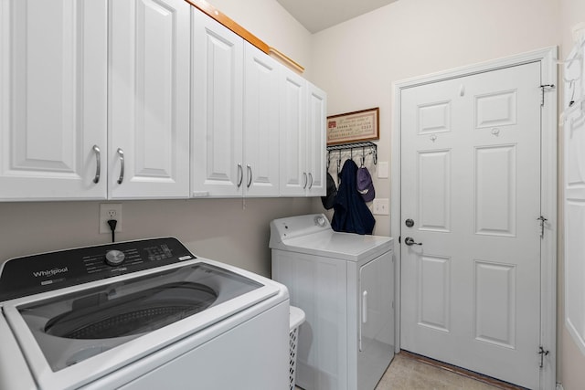 1230 Chickadee Cir, Hermitage, TN 37076 - laundry area featuring cabinet space and washing machine and clothes dryer