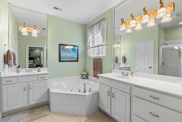 1230 Chickadee Cir, Hermitage, TN 37076 - ensuite bathroom featuring ensuite bathroom, visible vents, a stall shower, tile patterned flooring, and a whirlpool tub