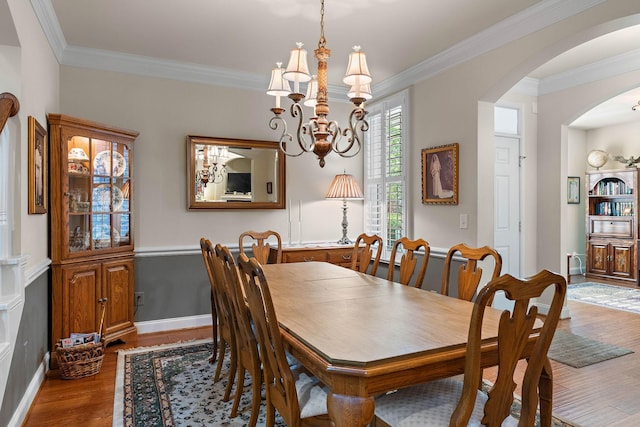 1230 Chickadee Cir, Hermitage, TN 37076 - dining room with a chandelier, ornamental molding, arched walkways, and wood finished floors