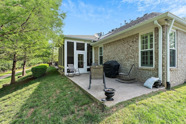 1230 Chickadee Cir, Hermitage, TN 37076 - rear view of property with brick siding, a yard, a patio, a sunroom, and a shingled roof