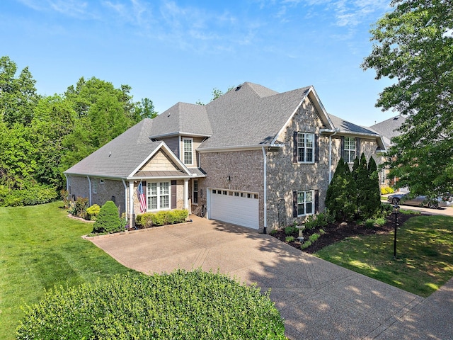 1230 Chickadee Cir, Hermitage, TN 37076 - view of front facade with concrete driveway, brick siding, an attached garage, and a front yard