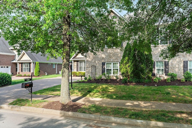 1230 Chickadee Cir, Hermitage, TN 37076 - view of front of property featuring brick siding and a front yard
