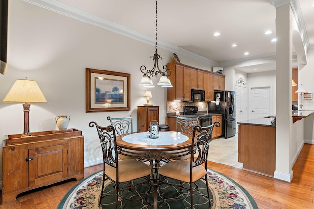 1230 Chickadee Cir, Hermitage, TN 37076 - dining area featuring crown molding, light wood-style floors, baseboards, and recessed lighting