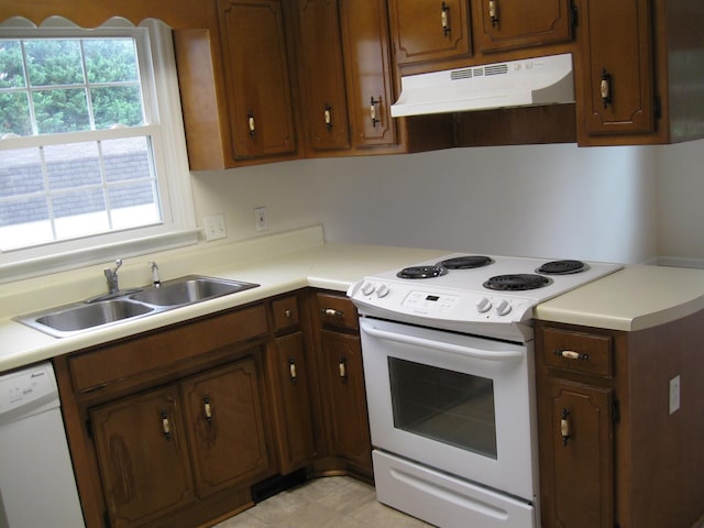 224 Gaines Cir, Estill Springs, TN 37330 - kitchen with white appliances, a sink, under cabinet range hood, and light countertops