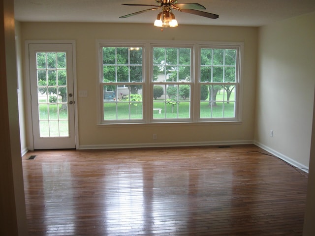 224 Gaines Cir, Estill Springs, TN 37330 - unfurnished room with plenty of natural light, baseboards, a ceiling fan, and hardwood / wood-style flooring