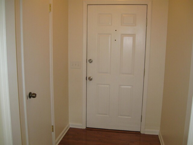 224 Gaines Cir, Estill Springs, TN 37330 - doorway to outside featuring baseboards and dark wood finished floors