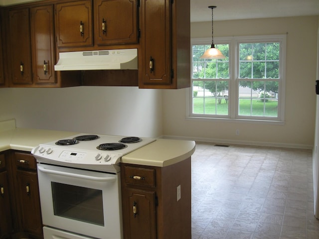 224 Gaines Cir, Estill Springs, TN 37330 - kitchen with light floors, under cabinet range hood, baseboards, white electric range, and light countertops