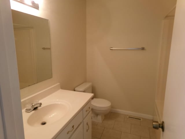 224 Gaines Cir, Estill Springs, TN 37330 - full bathroom with toilet, tile patterned floors, vanity, and baseboards
