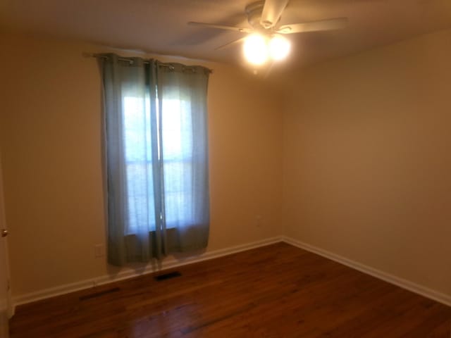 224 Gaines Cir, Estill Springs, TN 37330 - spare room with ceiling fan, wood finished floors, and baseboards