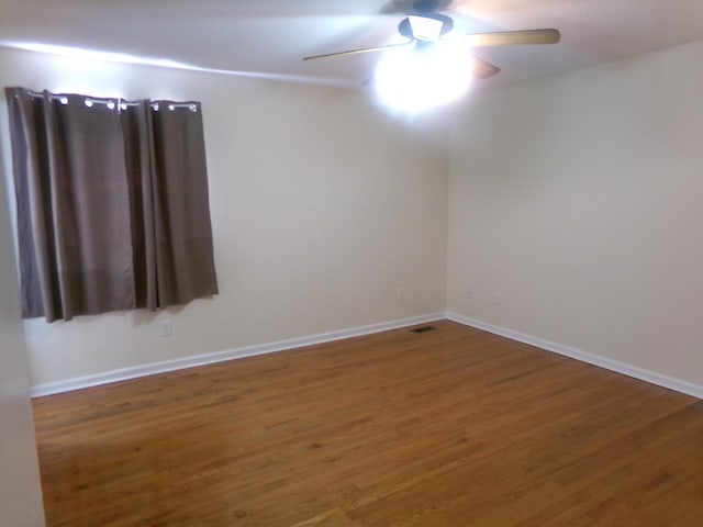 224 Gaines Cir, Estill Springs, TN 37330 - spare room featuring a ceiling fan, wood finished floors, and baseboards