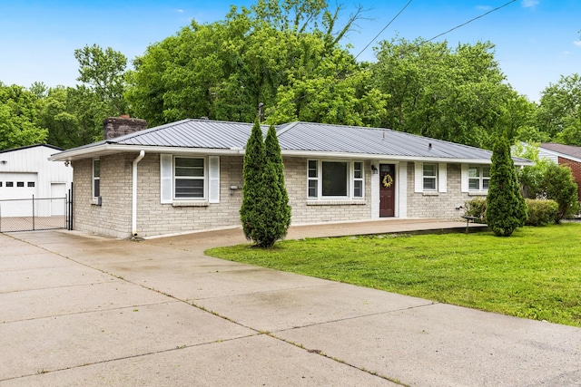 3103 Lakeland Dr, Nashville, TN 37214 - single story home featuring a chimney, metal roof, an outdoor structure, a detached garage, and a front yard