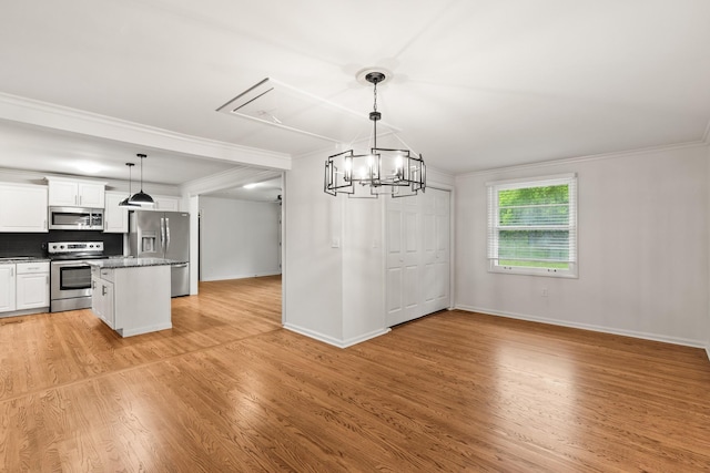 3103 Lakeland Dr, Nashville, TN 37214 - unfurnished dining area with ornamental molding, attic access, baseboards, and light wood-type flooring