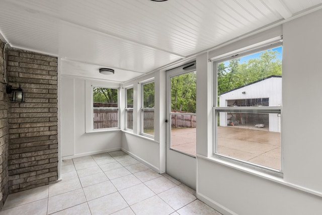 3103 Lakeland Dr, Nashville, TN 37214 - unfurnished sunroom featuring tile patterned flooring, baseboards, and a healthy amount of sunlight