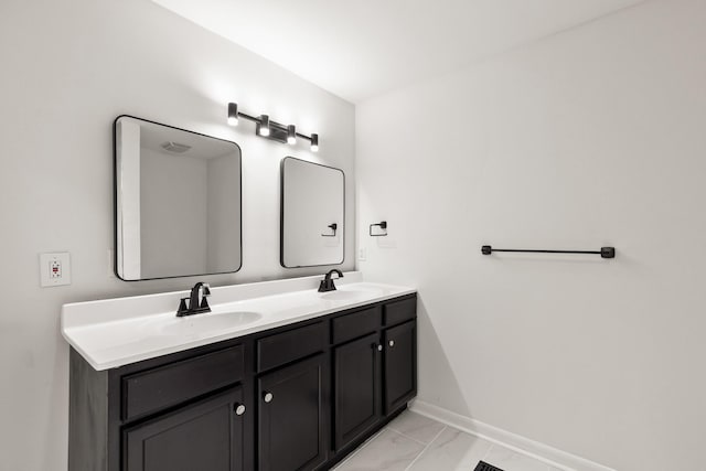 3103 Lakeland Dr, Nashville, TN 37214 - bathroom with baseboards, marble finish floor, double vanity, and a sink