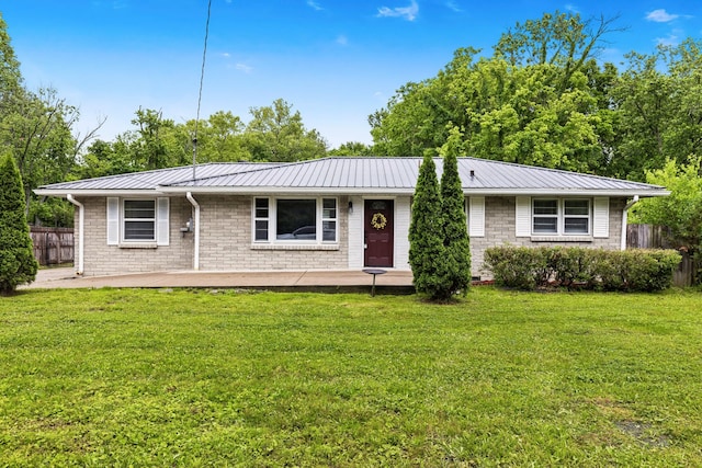 3103 Lakeland Dr, Nashville, TN 37214 - ranch-style home with metal roof, fence, and a front lawn