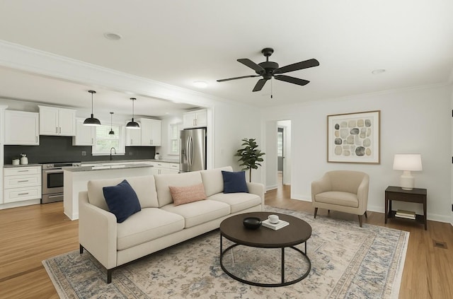 3103 Lakeland Dr, Nashville, TN 37214 - living room with ornamental molding, baseboards, a ceiling fan, and light wood-style flooring