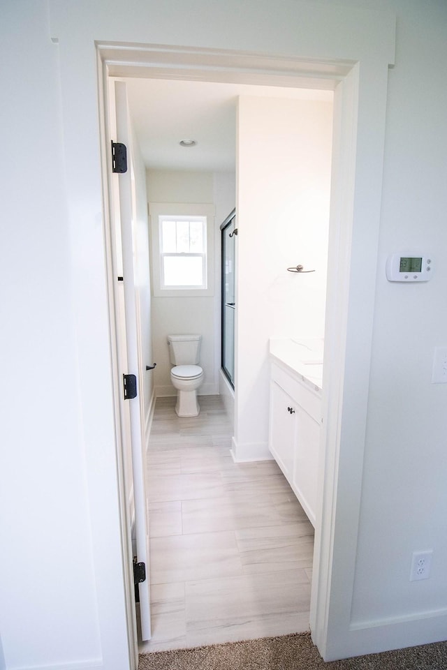 105 Shephard St N, Winchester, TN 37398 - full bath with vanity, toilet, an enclosed shower, and baseboards