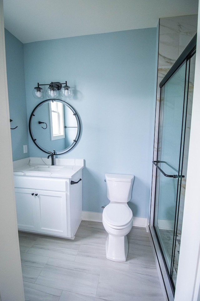 105 Shephard St N, Winchester, TN 37398 - bathroom with a stall shower, baseboards, vanity, and toilet