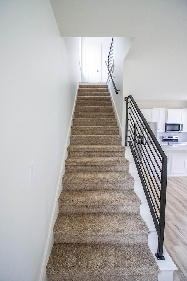 105 Shephard St N, Winchester, TN 37398 - stairway featuring baseboards and wood finished floors