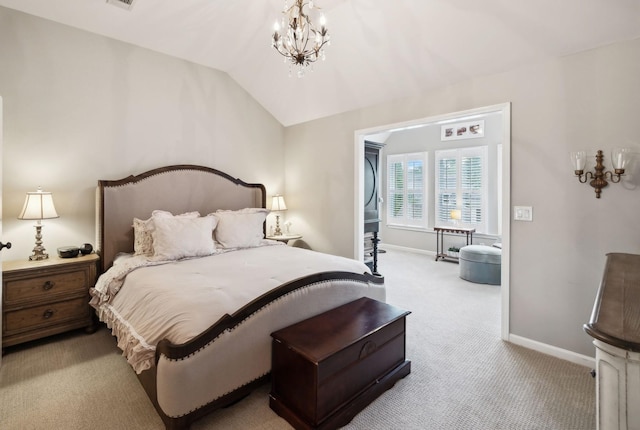 carpeted bedroom with a chandelier, lofted ceiling, baseboards, and visible vents
