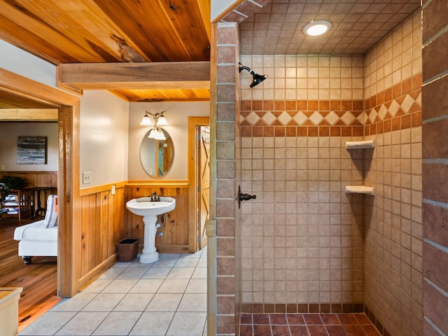 375 Good Hope Rd, Leoma, TN 38468 - bathroom featuring a wainscoted wall, wood ceiling with exposed beams, tile patterned flooring, a tile shower, and a sink
