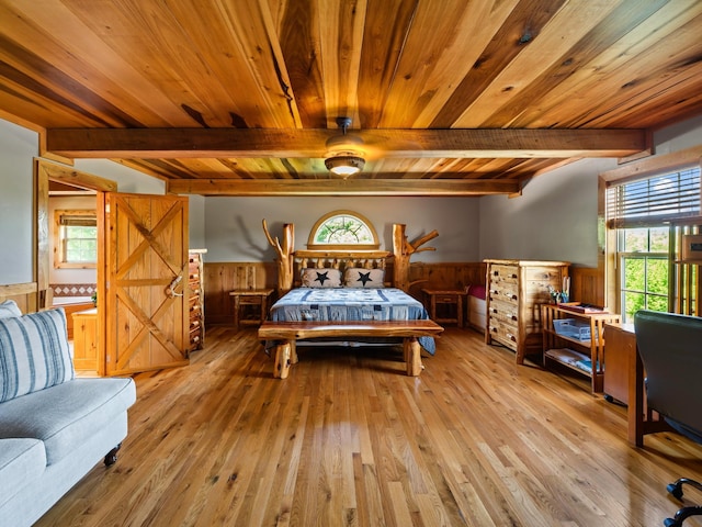 375 Good Hope Rd, Leoma, TN 38468 - bedroom featuring a wainscoted wall, wooden ceiling with exposed beams, light wood-type flooring, and wooden walls