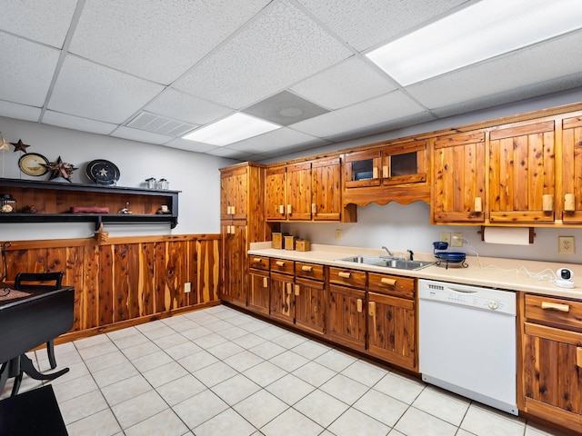 375 Good Hope Rd, Leoma, TN 38468 - kitchen with dishwasher, a sink, light countertops, a wainscoted wall, and brown cabinetry