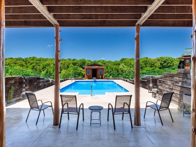 375 Good Hope Rd, Leoma, TN 38468 - view of pool featuring a patio, an outbuilding, and a forest view